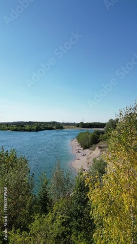  Hollerner See, Bavaria, Germany - Sandy strand of a Bavarian lake in a beautiful summer sunny day