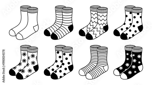 Black and white vector icon set of assorted socks with geometric motifs and festive winter patterns design