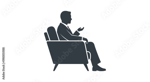 A man seated in an armchair gesturing with his hand silhouette