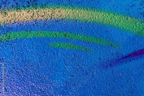 Beautiful colorful street art graffiti background. The wall is decorated with abstract drawings house paint. Modern style urban culture of street youth. Abstract picture on wall