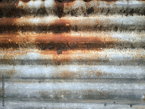 Φωτογραφία Texture of old rusty corrugated metal sheet with weathered surface