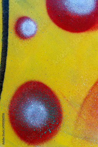 colorful background pattern of urban streen wall graffiti for concept and design. Aerosol bright vivid painting on a city walls