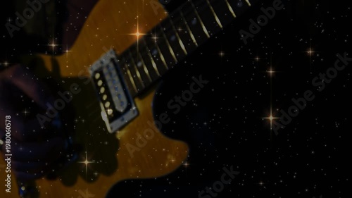 Guitarist entering frame and picking electric guitar for music, star overlay behind guitar