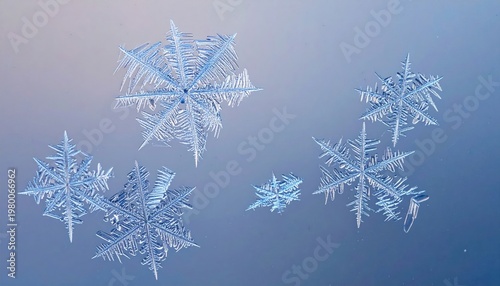 Delicate Snowflakes on Blue Gradient Background.