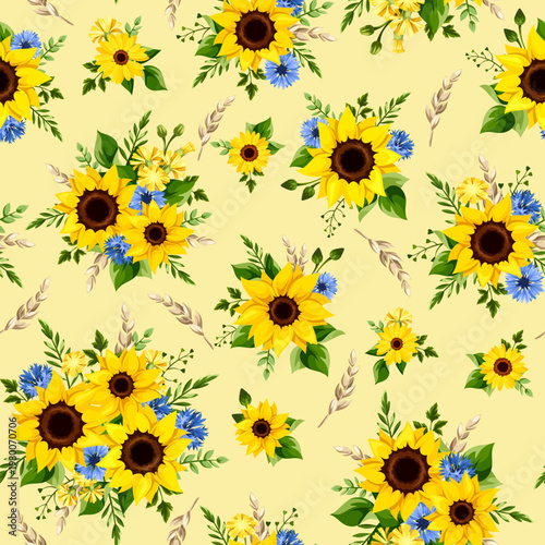 Seamless floral pattern with yellow sunflowers, blue cornflowers, and ears of wheat on a yellow background. Vector floral print