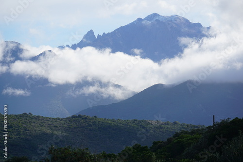 panoramic view of the clouds over the mountains on the island of corsica, france near galeria