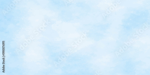 Fluffy white clouds drift across a bright blue summer sky, creating a beautiful nature cloudscape with a clear atmosphere and sunny day light texture