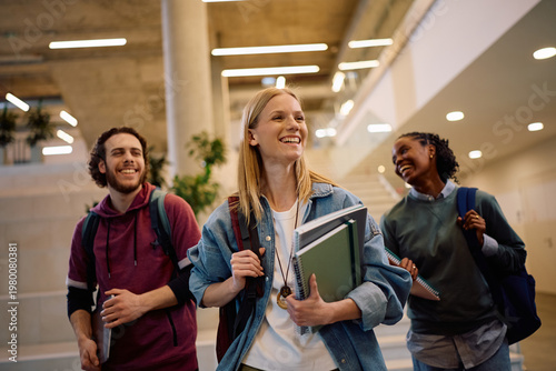 Fotografie Happy student and her friends going on lecture at university.