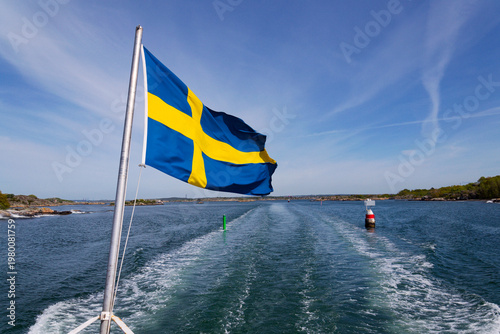 Картината върху платно Swedish flag on ferry near bridge between Styrso and Donso islands of Gothenburg