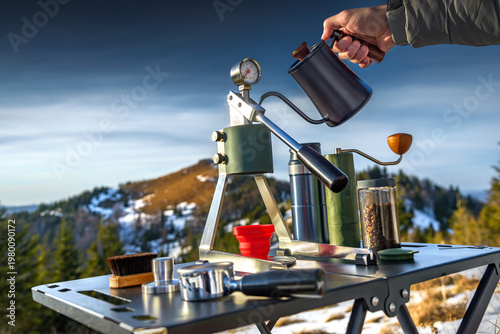 Manual coffee brewing outdoors, portable coffee setup, pouring hot water in mountains, camping lifestyle