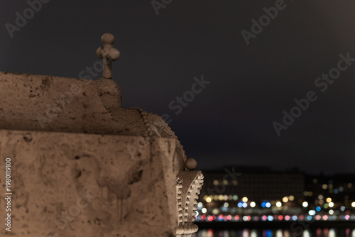 Stone cross shaped decoration on stone royal crown on Margit Margaret Bridge in Budapest in Hungary
