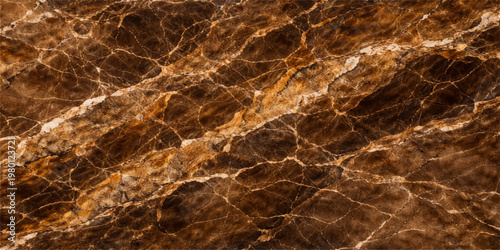 A seamless macro texture of natural sand and vintage stone creates a dark brown grunge pattern on the weathered surface of this organic design backdrop