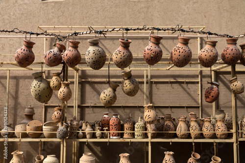 Fényképezés Traditional pottery market in Nizwa featuring handmade clay pots and crafts displayed in a cultural setting reflecting heritage and local craftsmanship