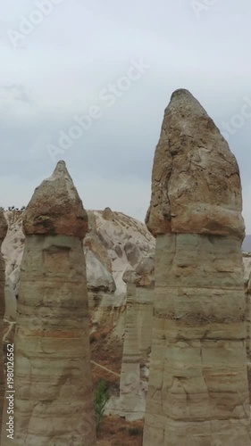 Drone view of the Valley of Love in Cappadocia, Turkey, featuring surreal rock formations and scenic landscape, showcasing natural geological wonders.	