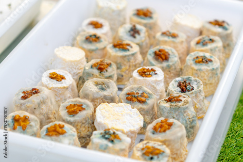Different types of cheese displayed at a street market
