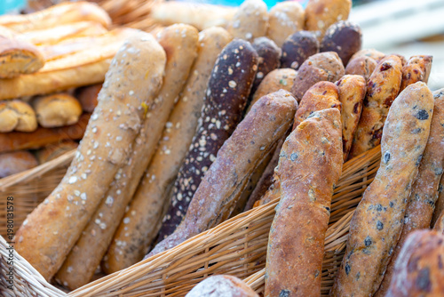 Different types of bread displayed at a street market. Food