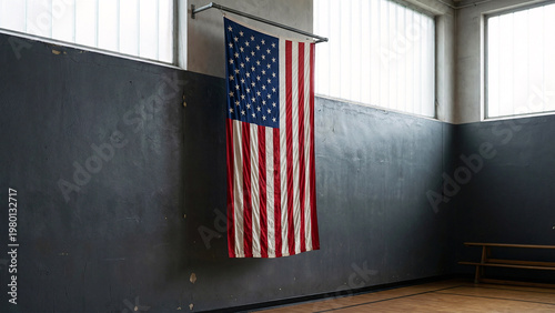United States Flag Hanging in Quiet School Gymnasium With Charcoal Wall Copy Space, Indoor Patriotic Background, Fabric Texture, Editorial Style