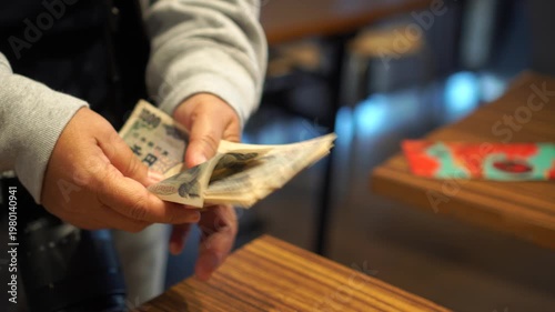 payment debt money banking on JPY Yen banknote in hands finance wealth