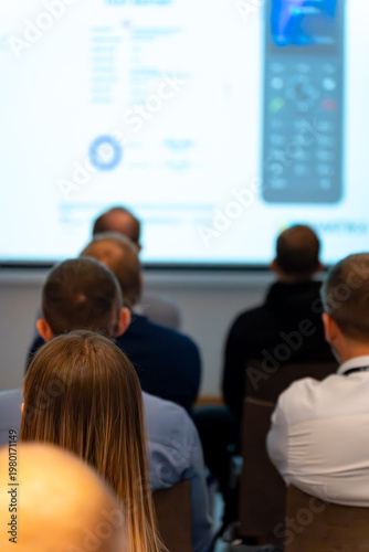 Wallpaper Mural Back view of an audience watching a technical presentation Torontodigital.ca