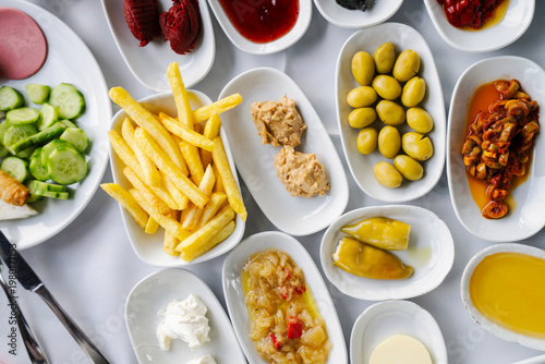 Turkish Breakfast Spread with French Fries, Olives, Hummus and Assorted Mezze, Top View