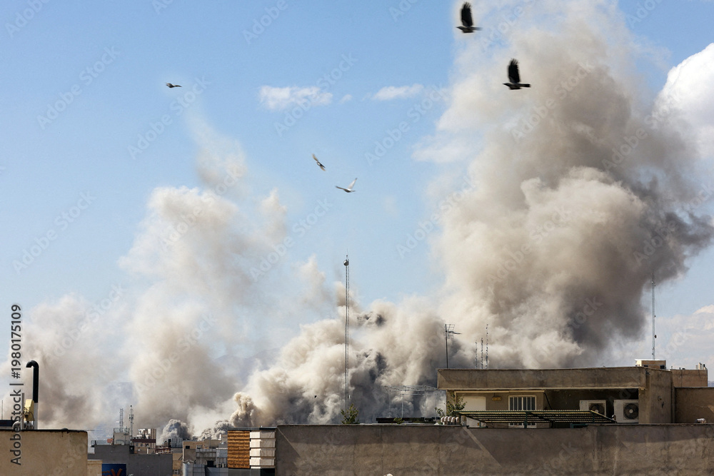 Obraz premium Explosion smoke billows over Tehran cityscape