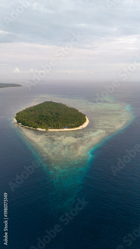 Drone aerial view of the beautiful raw Sicsican Island or also called Caxisigan Island in Balabac. Part of the Kamp Malaya expedition.