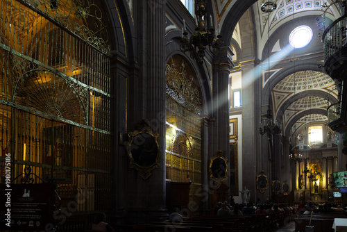 Puebla, Mexico - January 19, 2025: Close high angle view of Typical Orchestra musicians playing traditional instruments for attentive audience in sunlit colonial courtyard of Casa de la Cultura