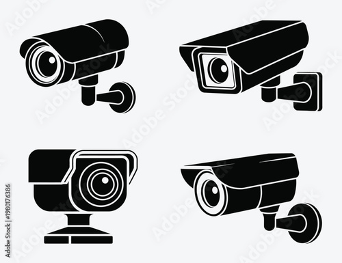 Set of four black security surveillance cameras