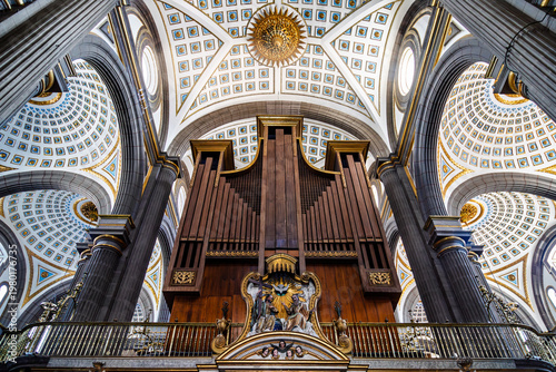 Cuadro en lienzo Low angle view of majestic pipe organ in choir loft of cathedral interior, frame