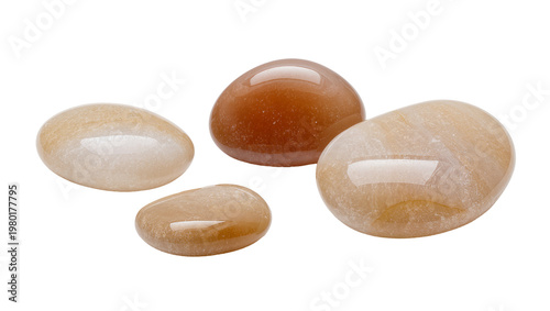 Foto Isolated group of natural polished gemstones, smooth mineral stones in earthy orange and beige tones