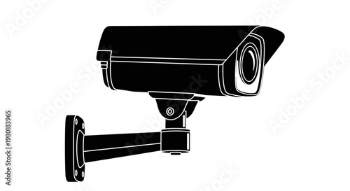 Black security camera mounted on a wall a stark silhouette