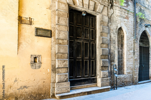 Tableau sur toile Facade of the former Church of the Suffragio, embedded between buildings in Via