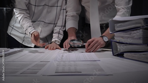 Konstfotografi Business people collaborating on a late financial audit, scrutinizing company do