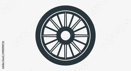 A dark spoked wheel on a light background.