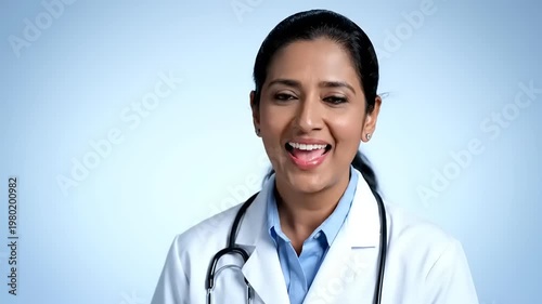 Professional female doctor wearing a white lab coat and stethoscope.