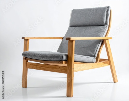A modern armchair with a light wood frame and gray cushions sits elegantly against a clean white background, showcasing a minimalist design aesthetic.