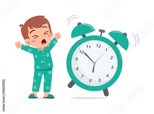 Cute cartoon child boy stretching and yawning waking up beside a ringing alarm clock happy morning routine