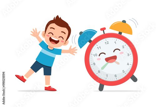 Happy excited boy with outstretched arms and a big smile standing next to a ringing red alarm clock