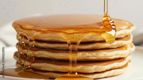 Maple Syrup Pouring Over a Stack of Fluffy Golden Pancakes