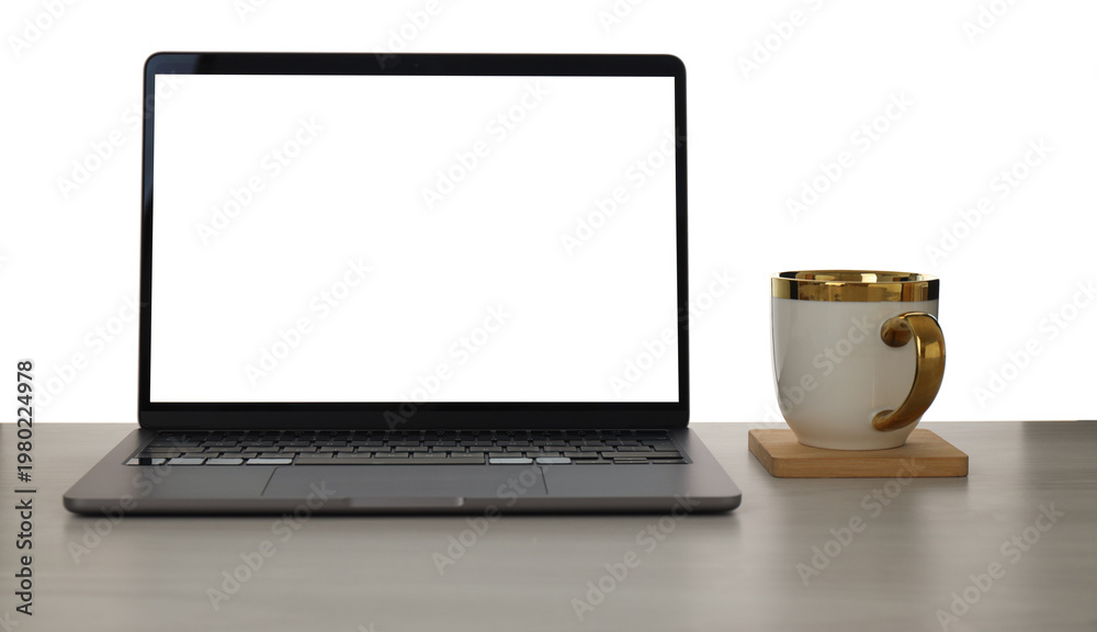 Fototapeta premium Laptop with blank screen and cup on wooden table against white background