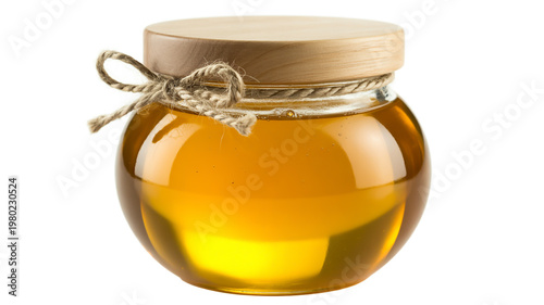 Glass jar of golden honey tied with decorative twine and ribbon