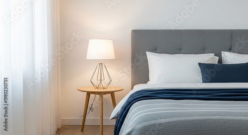 Minimalist Bedroom with Gray Headboard and Blue Blanket white pillows