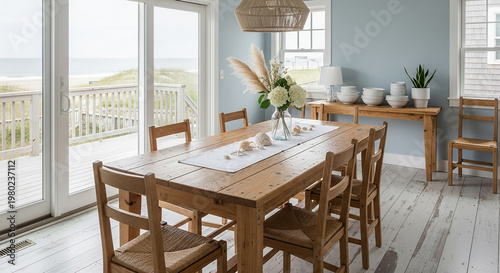 Wooden dining table with chairs in a bright coastal dining room with ocean view wooden chairs