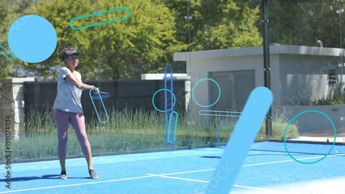 Sportswoman tracking ball, striking on blue court during rally, animated blue shapes moving across