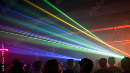 Crowd at Nightclub Party Under Colorful Laser Lights and Smoke