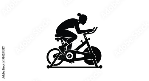 Silhouette of a woman intensely exercising on an indoor stationary cycling bike fitness focused