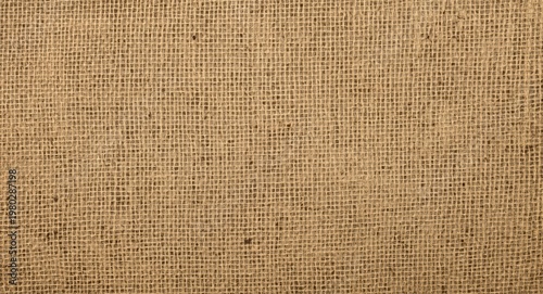 Top view close up of natural burlap fabric featuring rough woven texture and abstract background
