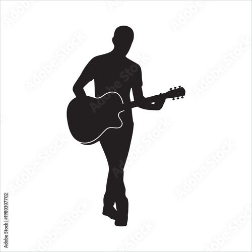 Silhouette of man playing acoustic guitar standing in relaxed pose.
