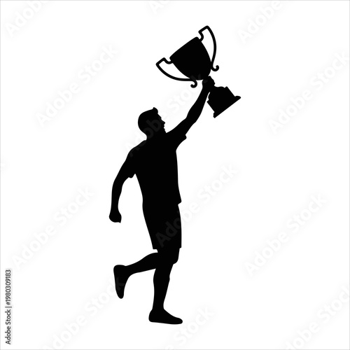 Silhouette of a triumphant male athlete holding a trophy high in celebration.