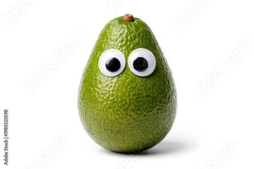 Funny avocado with googly eyes on a plain white background